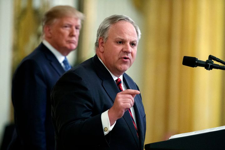 President Donald Trump listens as Interior Secretary David Bernhardt speaks during an event on the environment at the White House in July 2019.