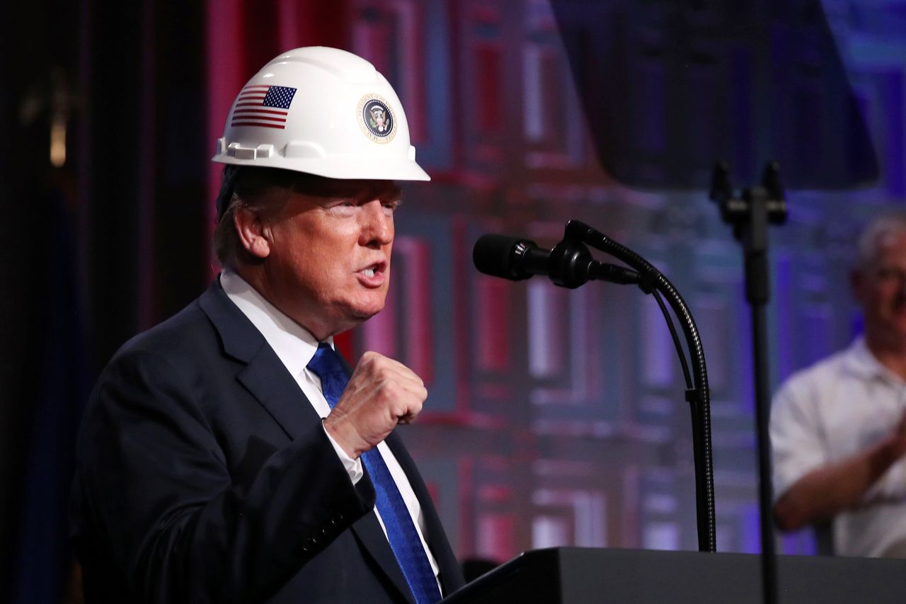 President Donald Trump addresses a crowd of electrical contractors. Trump's celebration of blue-collar workers was a key part of his appeal in 2016, but he hasn't governed accordingly.