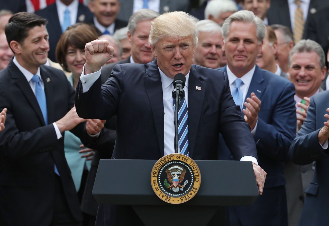 Trump celebrates the House's vote to repeal the Affordable Care Act with then-House Speaker Paul Ryan (Wis.), left. The president has never delivered on his promises of universal coverage.