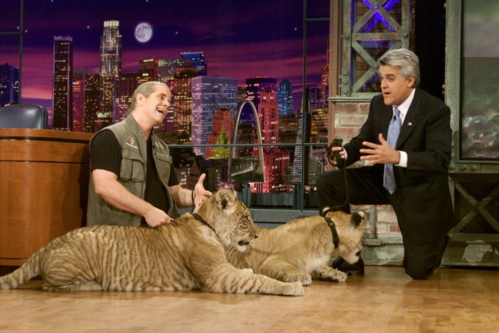 Doc Antle with two big cats during an interview with "Tonight Show" host Jay Leno on May 1, 2002.