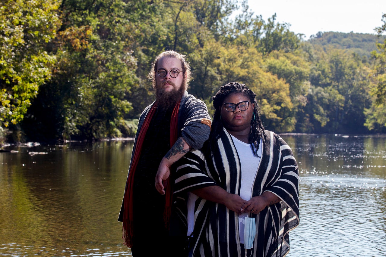 Kitzo-Creed and her husband Aaron stand in the middle of Brandywine Creek at the First State National Historic Park in Wilmington, Delaware, on Oct. 9, 2020. The park is one of the few places they feel comfortable visiting as political tensions and rates of COVID-19 rise in the United States.