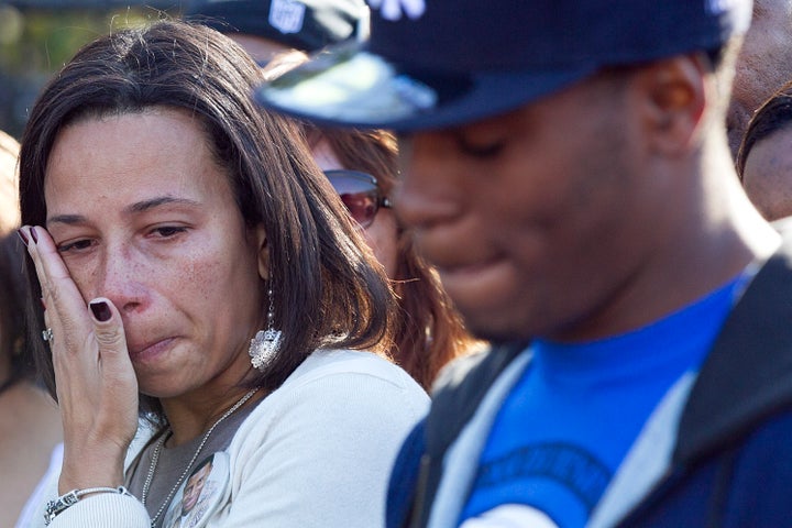 EASTON - OCTOBER 17: Danroy Henry's mother Angela wipes away a tear as Brandon Cox who was with Henry the night he was killed