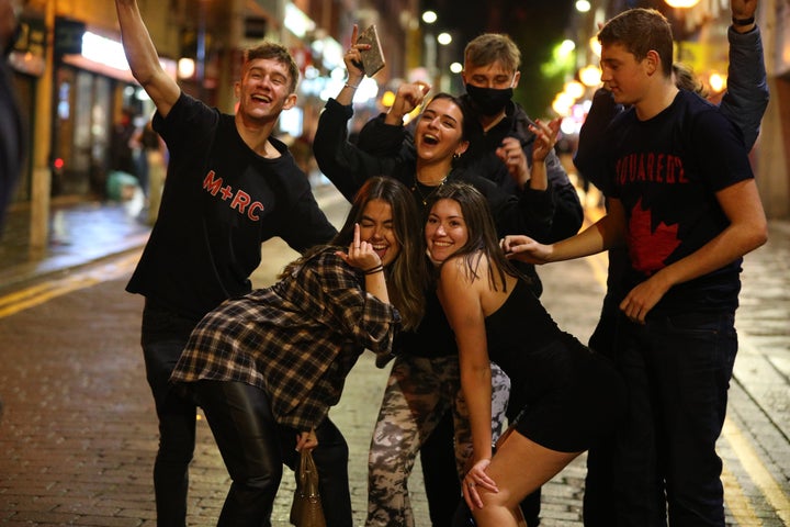 People out socializing in Liverpool city center, ahead of the 10pm curfew on Saturday night.