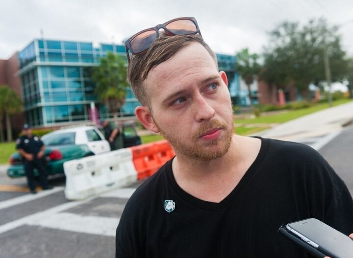 Talking to Colton Fears, who's wearing a Nazi pin, outside an event at the University of Florida, where white supremacist Ric