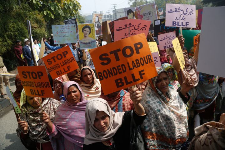 In this March 8, 2020 file photo, Pakistani activists take part in an International Women's Day rally in Lahore, Pakistan.