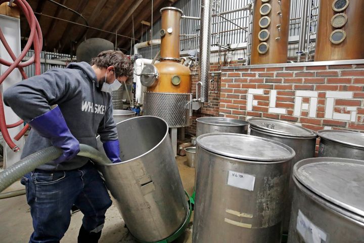 Owner and distiller Brian Ferguson loads a batch of alcohol into a still while making hand sanitizer at the Flag Hill Distillery in Lee, New Hampshire, on May 8. The distillery, which usually produces whisky, rum and vodka, temporarily suspended normal operations to manufacture hand sanitizer.