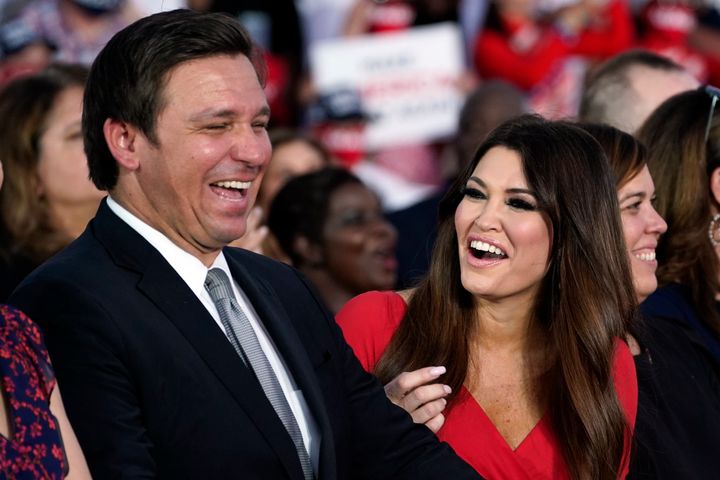 DeSantis laughs it up with Guilfoyle at Trump's rally.