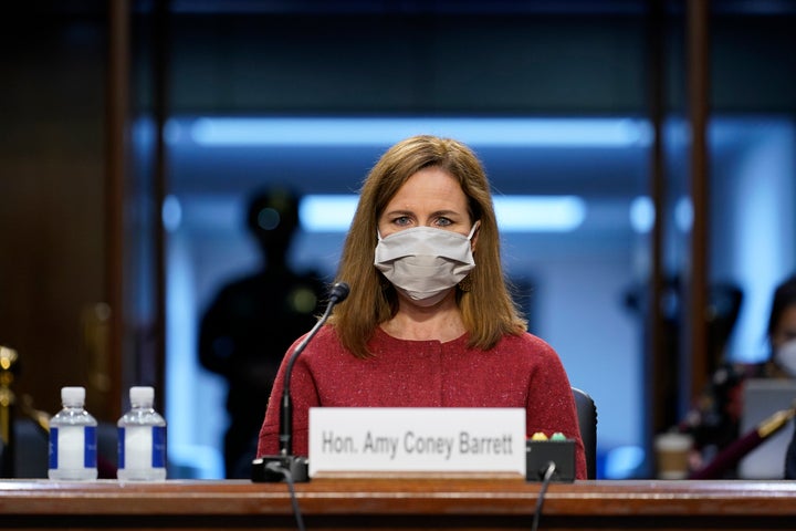 Supreme Court nominee Amy Coney Barrett at her confirmation hearing on Tuesday. She dodged questions about how she would rule on the forthcoming Supreme Court case about the Affordable Care Act. 