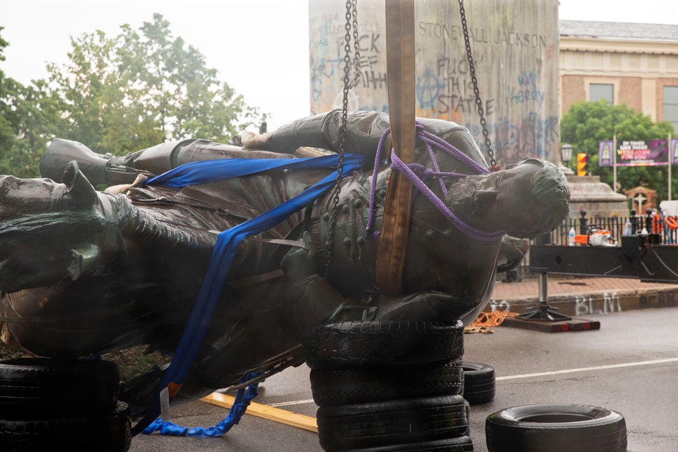 The Stonewall Jackson statue is removed from Monument Avenue in Richmond, Virginia, on July 1. Workers...