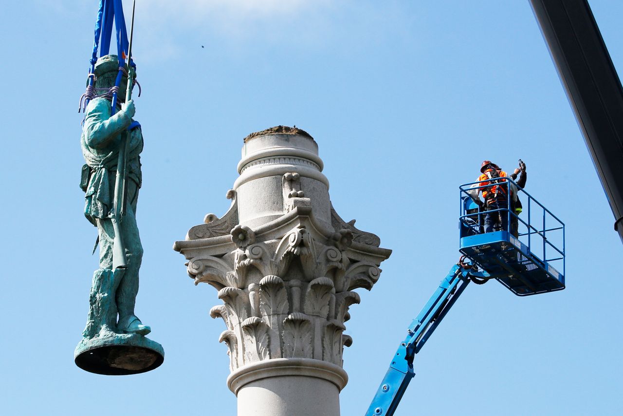 Crews remove the Confederate Soldiers and Sailors Monument in Libby Hill Park in Richmond, Virginia, on July 8. At least 63 Confederate statues, monuments or markers have been removed from public land across the country since Floyd's death, making 2020 one of the busiest years yet for removals, according to an Associated Press tally.