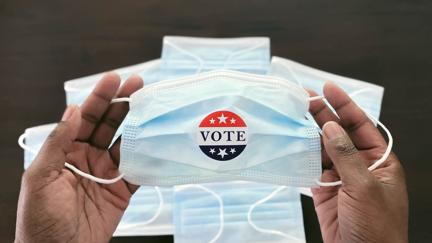 Is It Safe To Vote In Person During COVID-19? Experts Weigh The Risks.