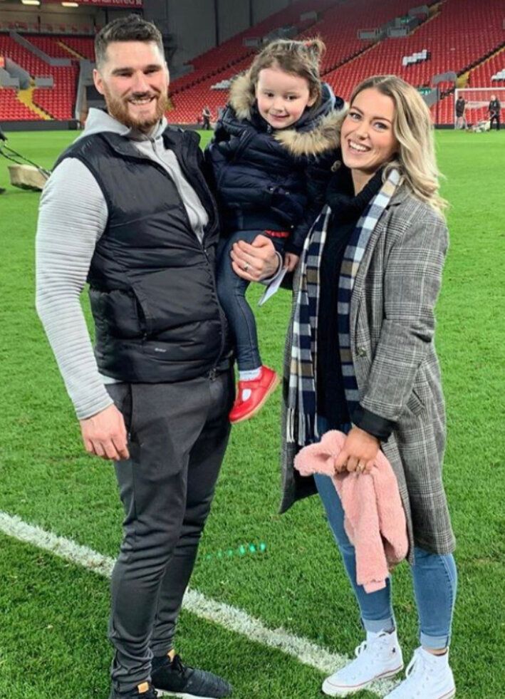 Carly Maynard, pictured here with her husband and daughter.