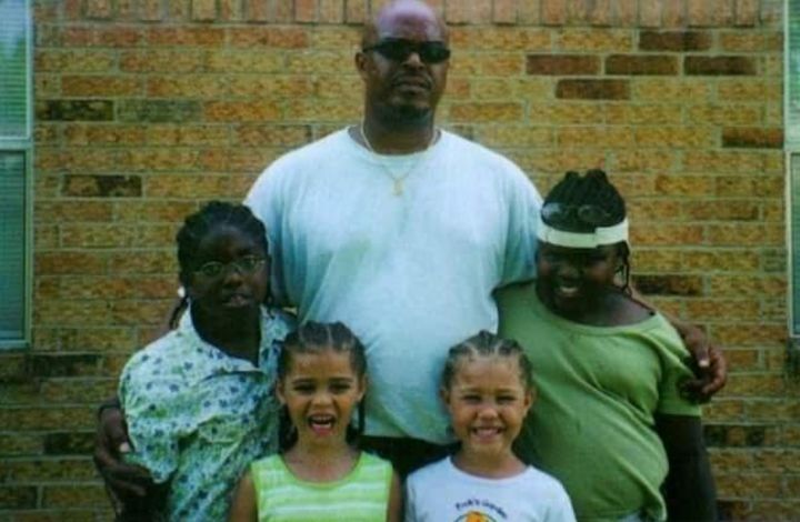 A 9-year-old Mauree Turner, left, with her siblings and father in 2002, outside Redemption church, a program where families could spend time with a family member transitioning back into life outside of prison. 