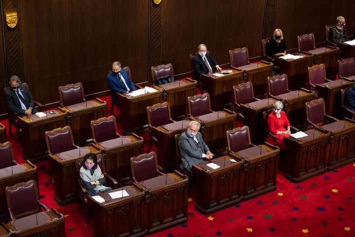 Senators sit physically distanced as they listen throne speech in the Senate of Canada building in Ottawa on Sept. 23, 2020.