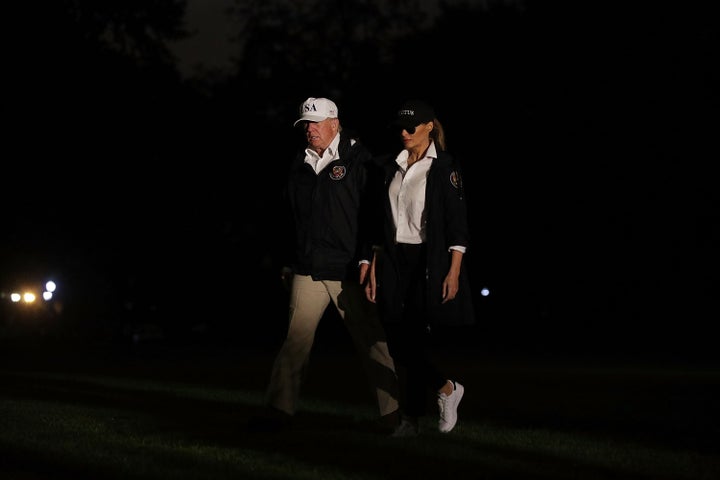 Melania Trump wears sneakers when arriving back at the White House.