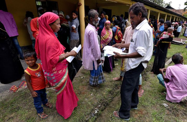 Villagers wait outside the National Register of Citizens (NRC) centre to get their documents verified by government officials, at Mayong Village in Morigaon district, Assam, India July 8, 2018. 