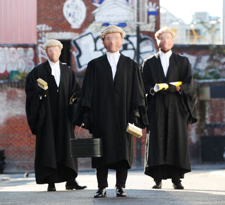 The Secret Barrister and two masked associates take to the streets of London to spread the word about the new book release, 'Fake Law: The Truth About Justice in an Age of Lies'