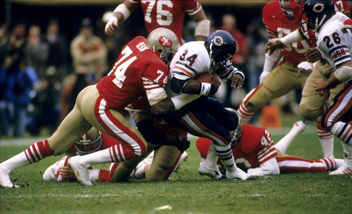 Fred Dean tackles future fellow Hall of Famer Walter Payton in the 1984 NFC Championship Game.