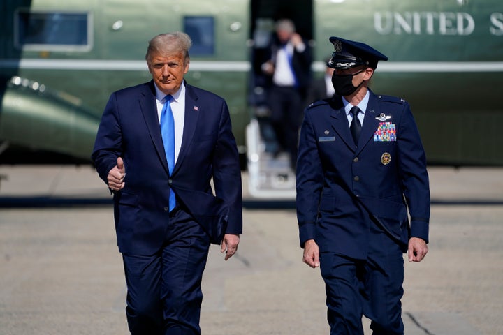 President Donald Trump gives a thumbs-up as he walks to board Air Force One at Andrews Air Force Base in Maryland for a trip to Greenville, North Carolina, to attend a campaign rally on Oct. 15.