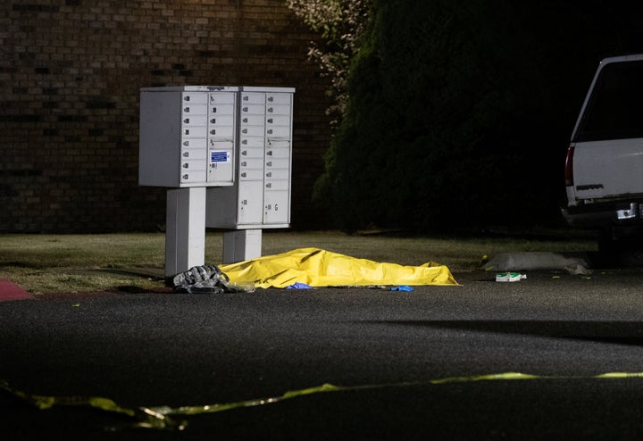 A tarpaulin covering the body of a man who is reportedly Michael Forest Reinoehl is seen after he was shot and killed by law enforcement outside Tanglewilde Terrace in Lacey, Washington, on Sept. 3.