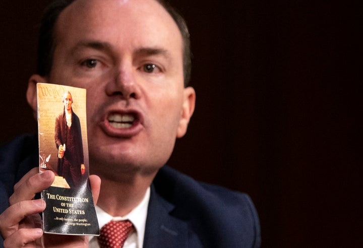 Sen. Mike Lee (R-Utah) holds up a copy of the U.S. Constitution during the Supreme Court confirmation hearing for Judge Amy Coney Barrett on Monday.