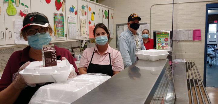 Ann Pulisz (right) works in a school cafeteria in Wallingford, Connecticut. The cafeteria staff is shorthanded due to workers who wouldn't return because of the risk of COVID-19.