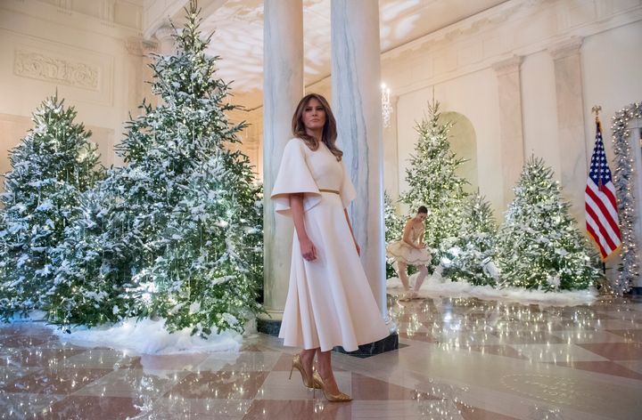 Melania Trump stands in the Grand Foyer as she tours Christmas decorations at the White House in Washington, DC, Nov. 27, 2017.