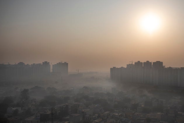 Morning haze envelops the skyline on the outskirts of New Delhi, India, Friday, Oct. 16, 2020. The national...
