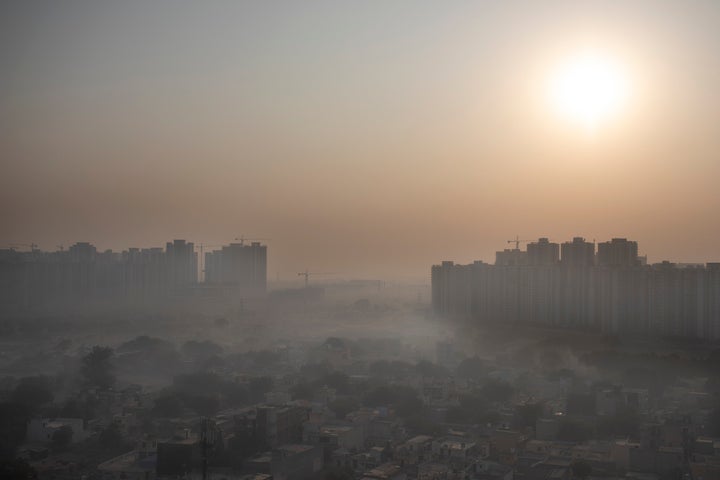Morning haze envelops the skyline on the outskirts of New Delhi, India, Friday, Oct. 16, 2020. The national capital, one of the world’s most polluted cities, enjoyed a respite from air pollution up until September due to a strict virus lockdown. But now with the onset of winter leading to the dying down of winds and industrial activities resuming and cars back on the roads, the air quality in the city has once again fallen to poor levels.