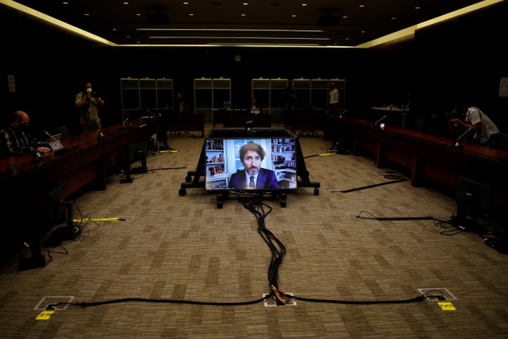 Canada's Prime Minister Justin Trudeau is seen on a screen as he attends a House of Commons finance committee meeting in Ottawa, Ontario, Canada July 30, 2020. REUTERS/Blair Gable TPX IMAGES OF THE DAY