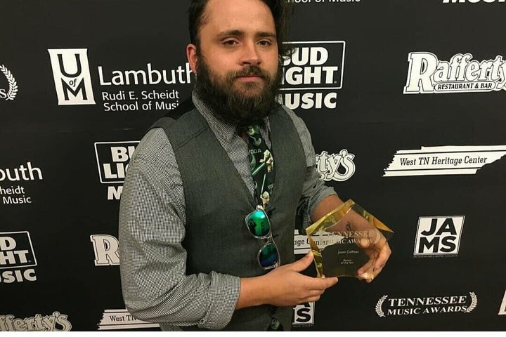 Justin Coffman with his award as bassist of the year in Tennessee.