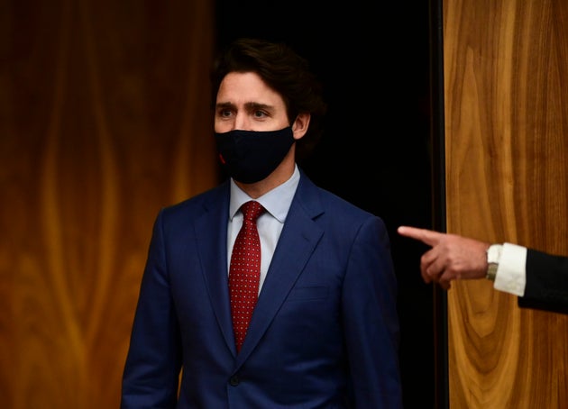 Prime Minister Justin Trudeau makes his way to a press conference during the COVID pandemic in Ottawa on Friday.