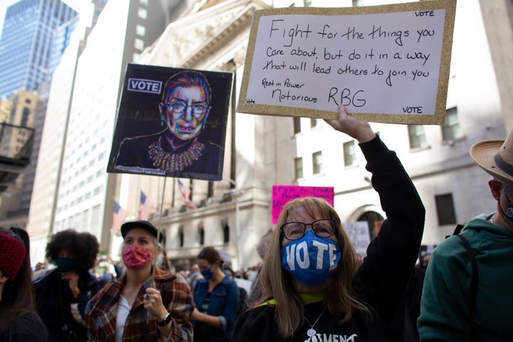 The late Justice Ruth Bader Ginsburg, whose seat Barrett has been nominated to fill, appeared on many signs on Saturday.