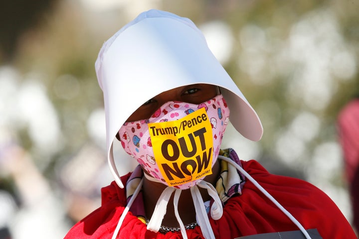 A woman dressed as handmaiden in Washington.