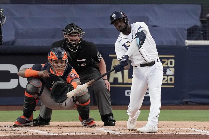 Tampa Bay Rays Randy Arozarena hits a two run home run against the Houston Astros during the first inning in Game 7 of a baseball American League Championship Series, Saturday, Oct. 17, 2020, in San Diego. (AP Photo/Jae C. Hong)