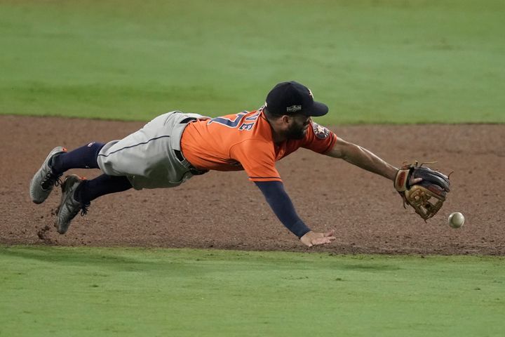 Houston Astros second baseman Jose Altuve misses a single by Tampa Bay Rays' Ji-Man Choi during the sixth inning in Game 7 of a baseball American League Championship Series, Saturday, Oct. 17, 2020, in San Diego. (AP Photo/Jae C. Hong)