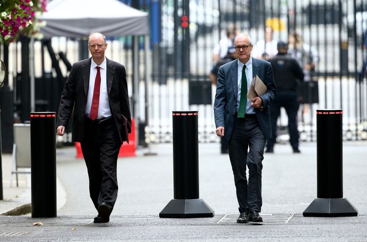 The government's chief medical officer Chris Whitty, left, and chief scientific adviser Patrick Vallance arrive in Downing Street, London, Monday Sept. 21, 2020. 