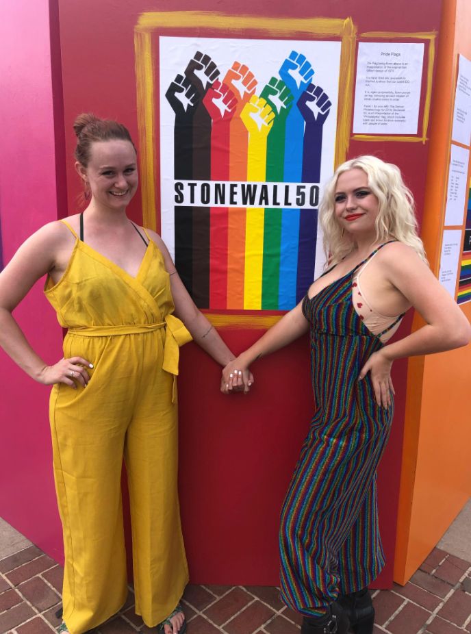 The author, left, at Pride Denver with friend Shanna Merceron in 2019.