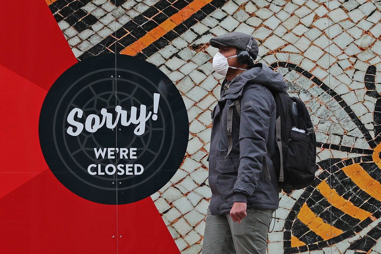 A man wearing a face mask in Manchester city centre as the row over Greater Manchester's coronavirus status continues.