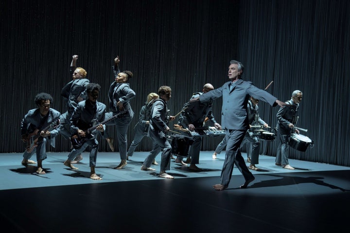 David Byrne and his band, with Giarmo and Kuumba dancing in the background.