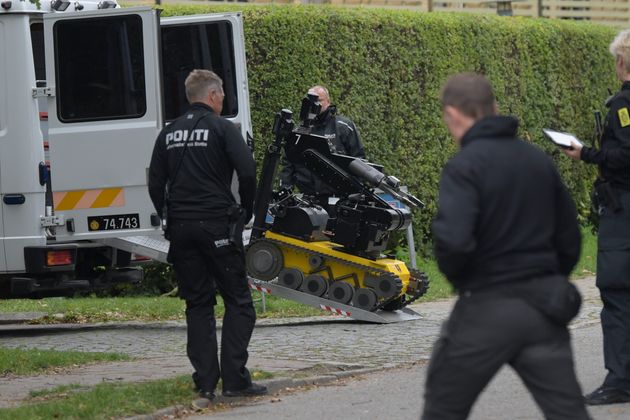 Police are at the scene and have brought a bomb-defusing robot amid reports the escapee has explosives on his person 