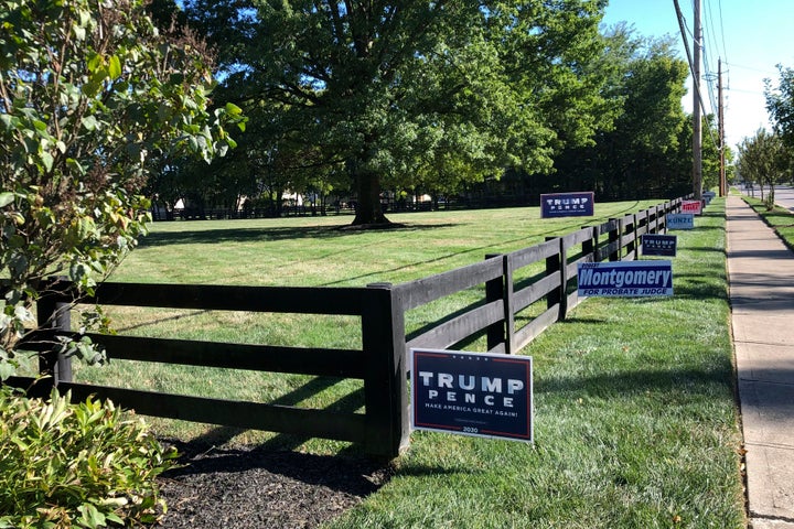 Signs in support of President Donald Trump and other Republican candidates on a lawn of a suburban Dublin, Ohio, home on on Sept. 18, 2020. 