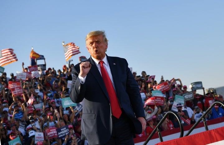 President Donald Trump holds a rally at Tucson International Airport on Oct. 19. He was not wearing a mask and neither were many of his rally attendees.