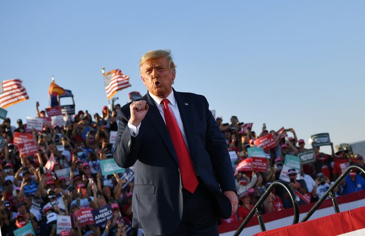 President Donald Trump holds a rally at Tucson International Airport on Oct. 19. He was not wearing a mask and neither were many of his rally attendees.