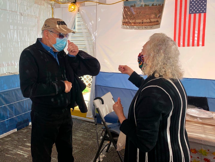 Holocaust survivors Israel "Sasha" Eisenberg, left, and Ruth Brandspiegel are reunited on Oct. 3, 2020, in East Brunswick, N.J. for the first time in more than 70 years since their families left the Hallein Displaced Persons Camp in Austria.