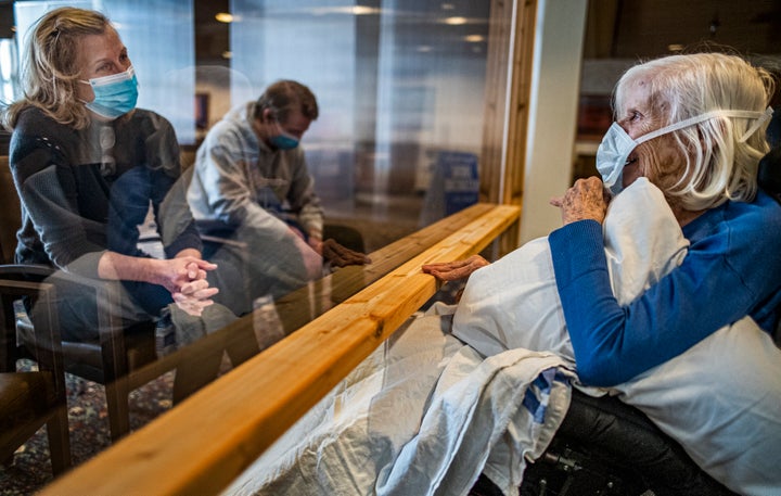 Carla Gillespie visits her mother, Evelyn Solberg, at the Jones-Harrison Residence in Minneapolis on Oct. 12. It was the first time they had been allowed to see each other since March, and the policy change came as COVID-19 cases again begin to rise across the U.S.