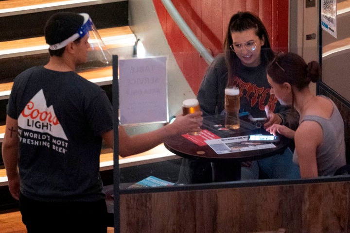 A file image of a group at a pub. Under tier 2 coronavirus restrictions, people can only mix within households and support bubbles indoors, including in pubs