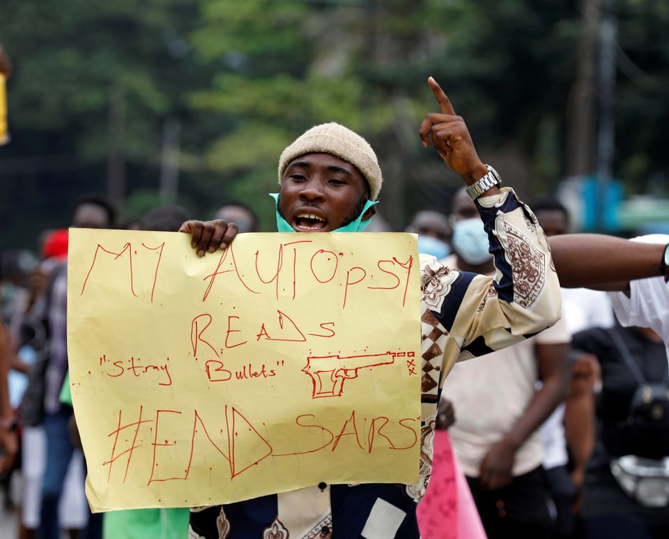 A man gestures as Nigerians take part in a protest against alleged violence, extortion and harassment from Nigeria's Special Anti-Robbery Squad (SARS), in Lagos, Nigeria October 11, 2020. REUTERS/Temilade Adelaja