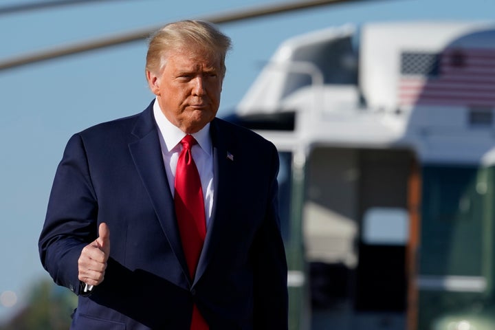 President Donald Trump gives a thumbs up as he walks to board Air Force One, Wednesday, Oct. 14, 2020, at Andrews Air Force Base.