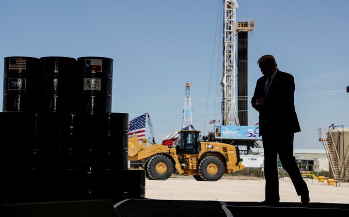 President Donald Trump arrives to deliver a speech during a tour of an oil rig in Midland, Texas, in July. a